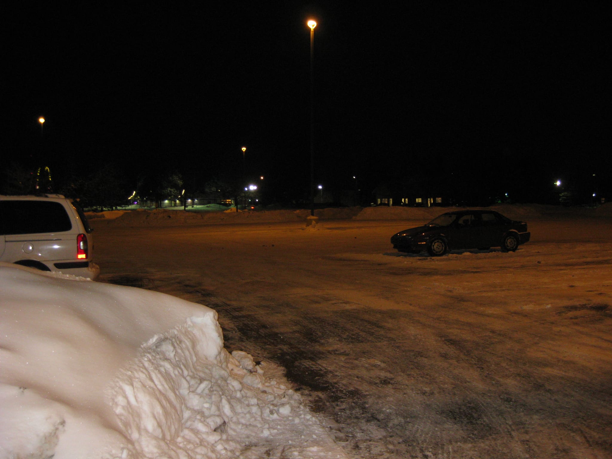 Snow piles at end of parking lot