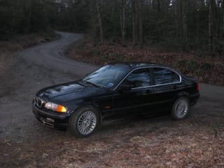 Bimmer on the dirt & gravel approach road