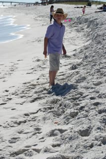 Hat-sporting Hayden on the beach