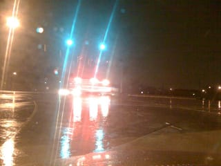Ambulance in the rain (bridge over I-77 in Charlotte)