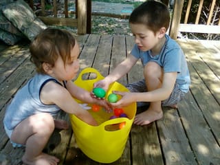 Robert and Will with easter eggs and water