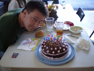 Posing with Mary's birthday cake - except I don't need quite that many candles :-)