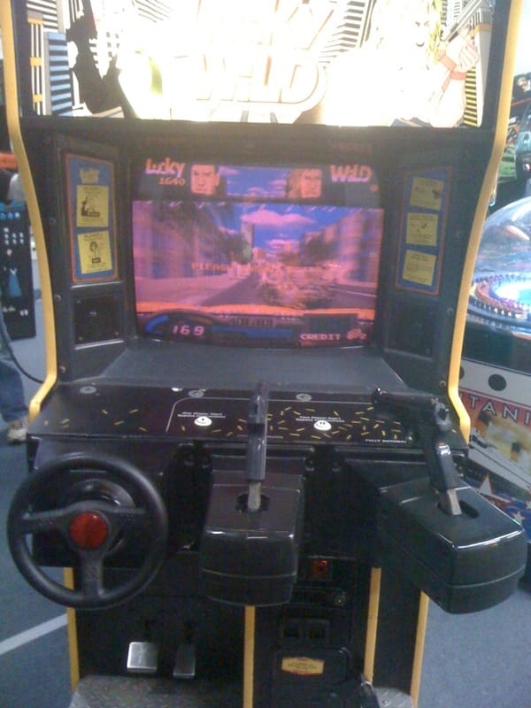 Once upon a time video games had a steering wheel and two pistols as standard equipment.