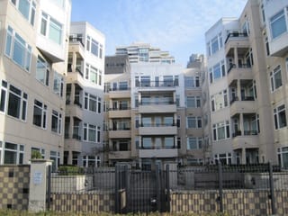 Some condo/apartment complex by the shore.