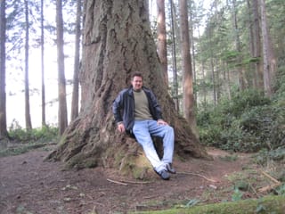 Chris sitting on a tree near West Beach, Deception Pass, WA