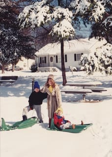 Chris, Mom & Mr Yellow Boggin' with their Amazing Green Sleds