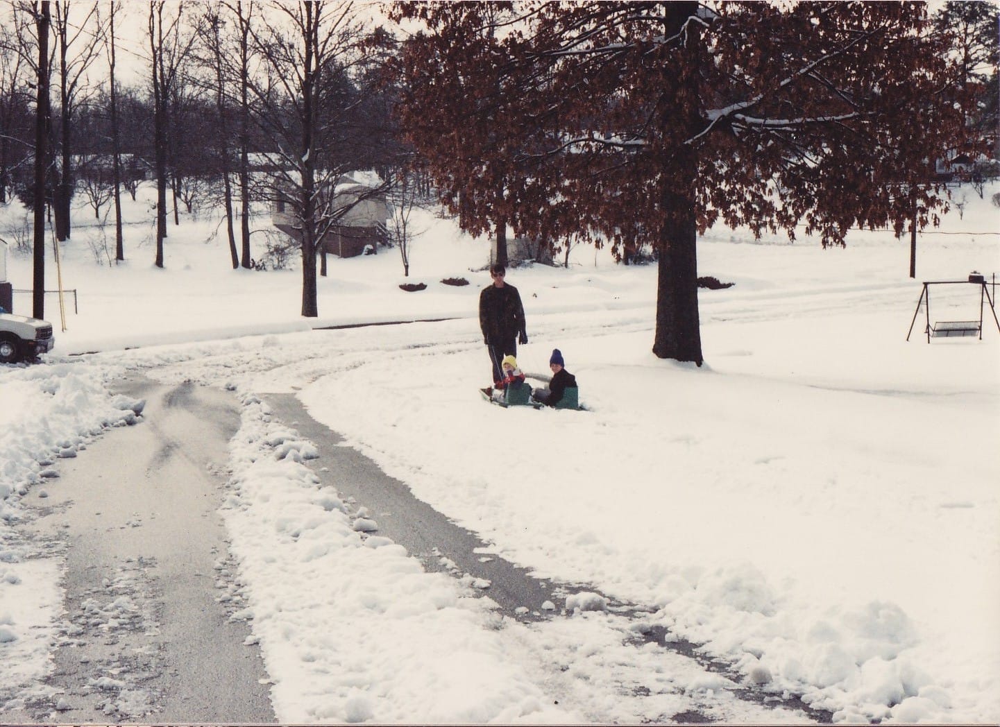 Dad and his sledding boys