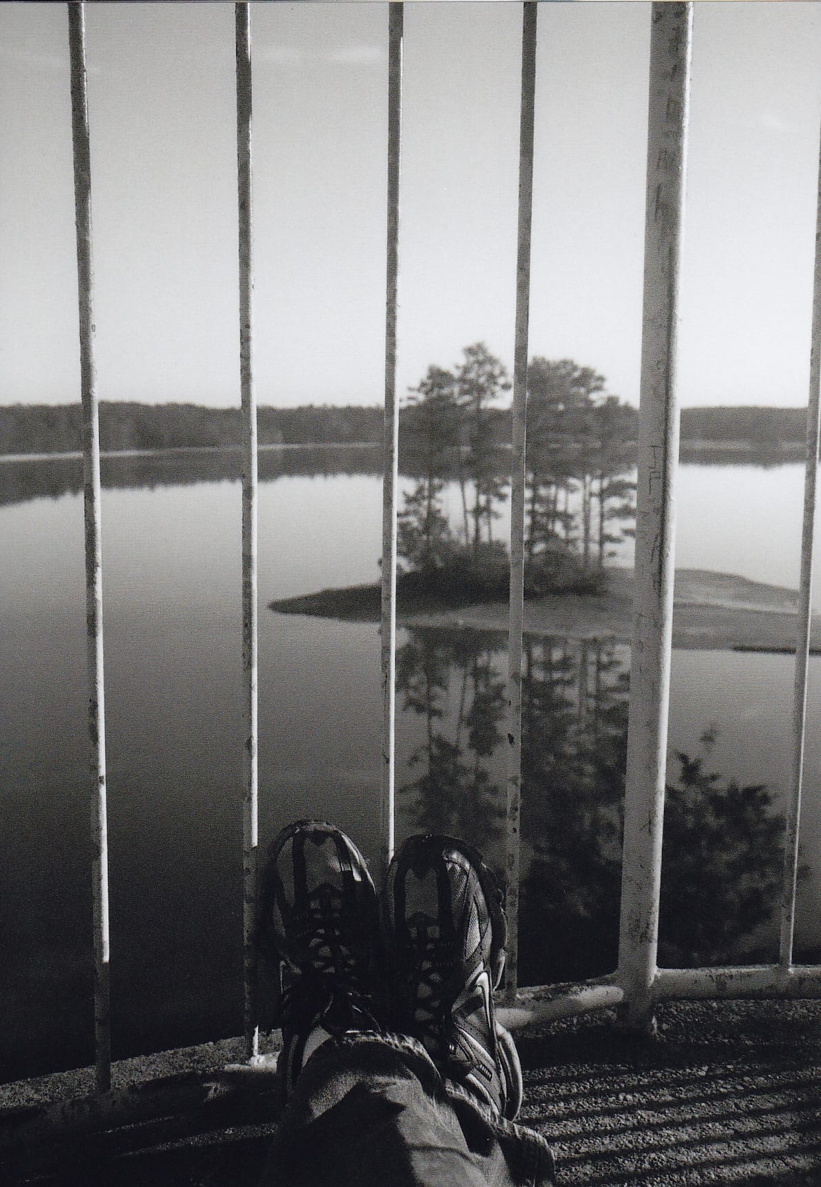 Travelling feet on top of a lighthouse looking out.