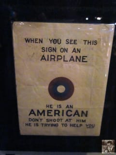 When you see this sign on an airplane, he is an American.  Don't shoot at him.  He is trying to help you! - Seattle Museum of Flight
